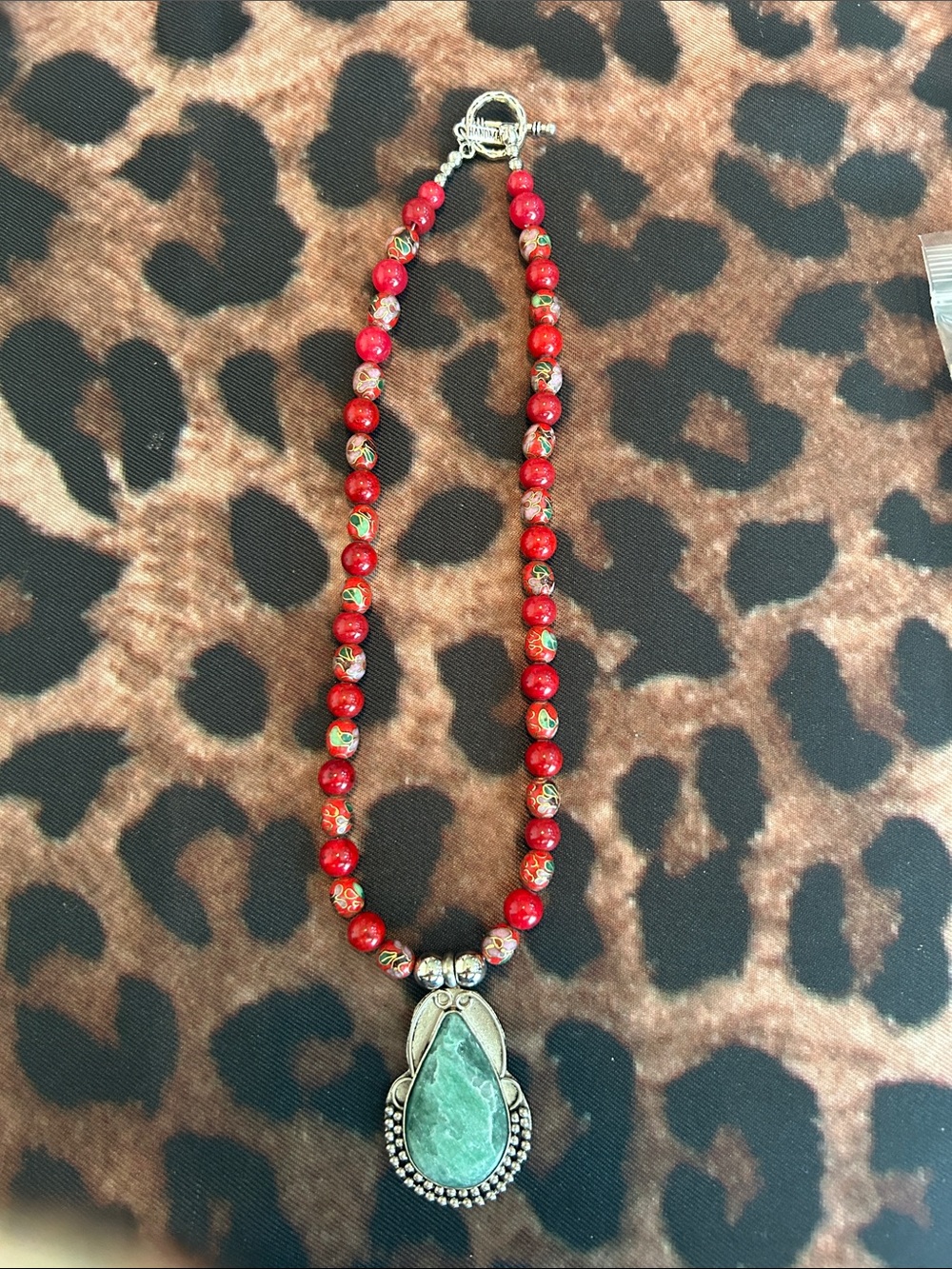 Red Beaded Necklace with Green Stone Pendant